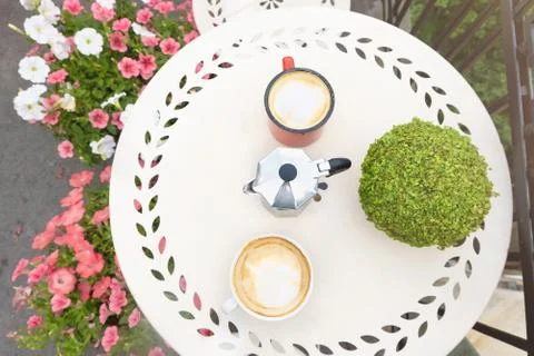 Top view of coffee table with coffee cups on balcony Stock Photos