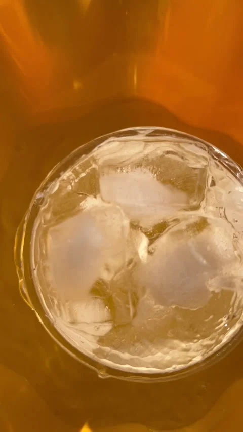 Top View Cold Water with Ice Cubes in Glass Macro Stock Footage 345153164