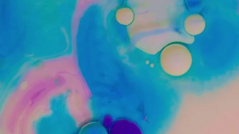 Top view of colored acrylic paint bubbles moving on milk, oil Stock Footage 252805511