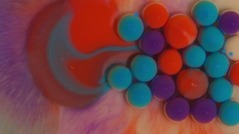 Top view of colored acrylic paint bubbles moving on milk, oil Stock Footage 252805595