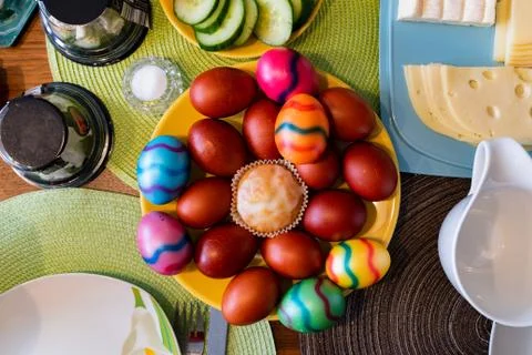 Top view on colored eggs on an Easter breakfast table Stock Photos