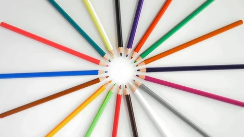 Top View, Colored Pencils Lying in a Circle Rotate on White Background Stock Footage 112619484