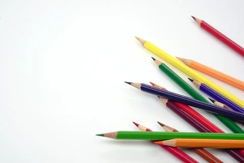Top view of colored pencils or pastel on white background. Learning, study .. Stock Photos