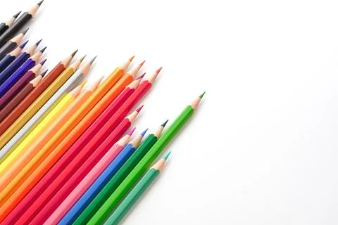 Top view of colored pencils or pastel on white background. Learning, study .. Stock Photos