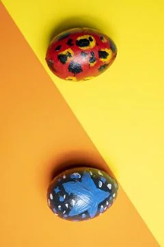 Top view of a colorful decorated easter eggs on a colored background. Conce.. Stock Photos