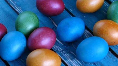 Top View Of Colorful Easter Eggs On A Blue Wooden Background Panning Slider Shot Stock Footage 126589160