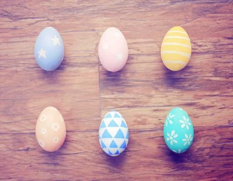 Top view of colorful easter eggs on wooden background with retro filter effec Stock-Fotos