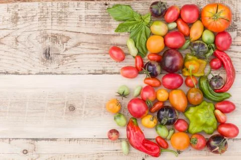Top view on colorful frame made of organic vegetables: tomatoes, paprika, and Stock Photos