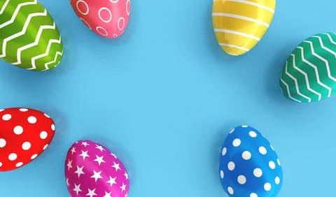 Top view of Colorful painted Easter eggs on blue floor background. Holiday .. Stock Photos