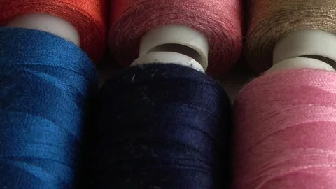 Top view of colorful thread spools isolated on white Stock Footage 169970646