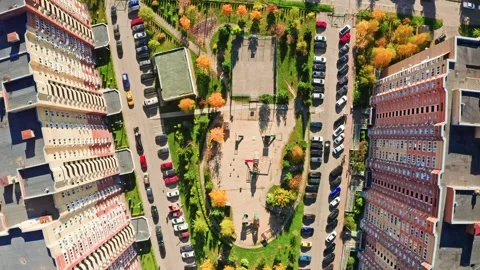 Top view of colorful yard with playground between highrise buildings Stockbeeldmateriaal 274047448