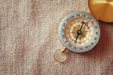 Top view of compass on canvas background Stock Photos