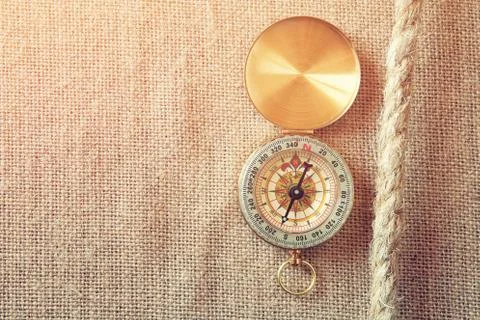Top view of compass on canvas background Stock Photos