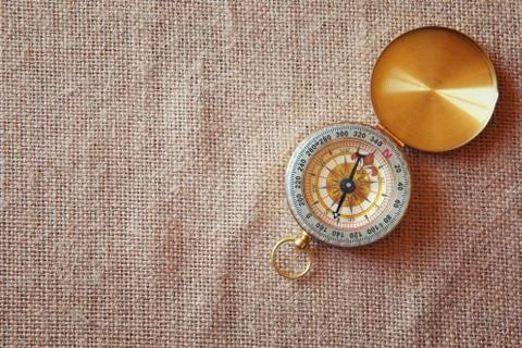 Top view of compass on canvas background Stock Photos