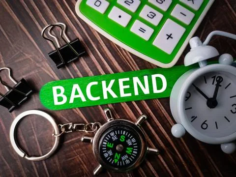 Top view compass,paper clips,clock and calculator with text BACKEND Stock-Fotos