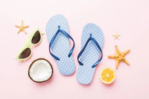 Top view composition of flip flops placed with beach accessories top view o.. Stock Photos