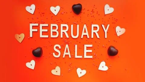 Top view on composition with hearts on red background. February sale Stock Photos