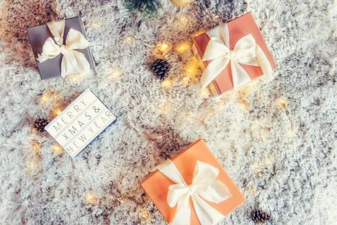 Top view composition of lighted box with Merry Christmas and New year wishes  Stock Photos