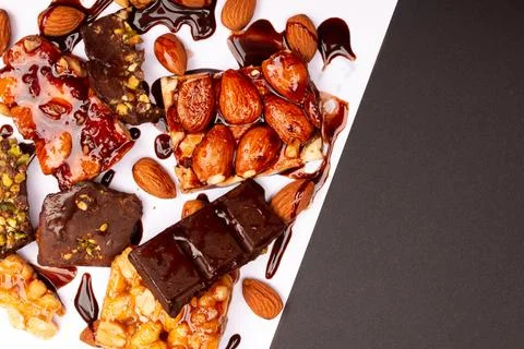 Top view composition or background with delicious chocolates and nuts Stock Photos