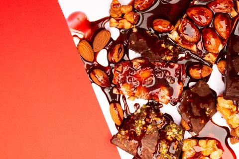 Top view composition or background with delicious chocolates and nuts Stock Photos