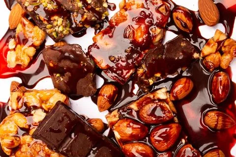 Top view composition or background with delicious chocolates and nuts Stock Photos