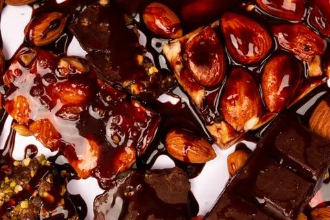 Top view composition or background with delicious chocolates and nuts Stock Photos