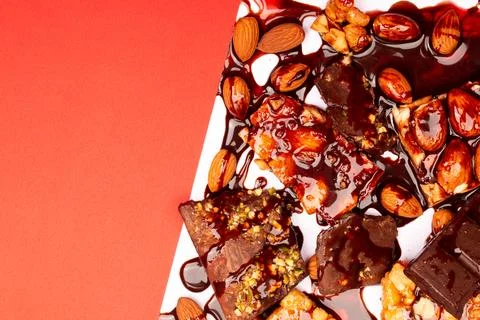 Top view composition or background with delicious chocolates and nuts Stock Photos
