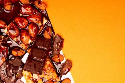 Top view composition or background with delicious chocolates and nuts Stock Photos