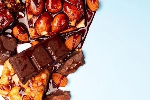 Top view composition or background with delicious chocolates and nuts Stock Photos