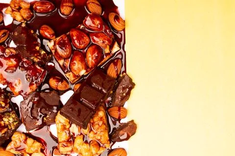 Top view composition or background with delicious chocolates and nuts Stock Photos