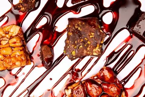 Top view composition or background with delicious chocolates and nuts Stock Photos