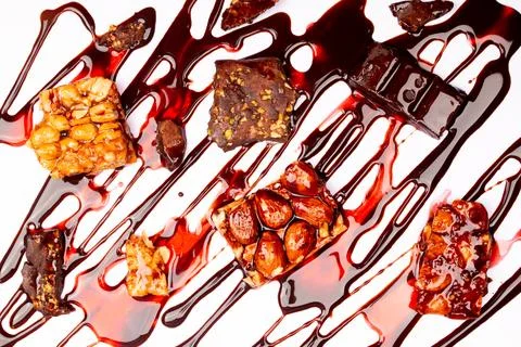 Top view composition or background with delicious chocolates and nuts Stock Photos