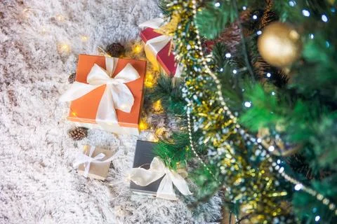 Top view composition of present boxes in colorful festive wrapping tied with  Stock Photos