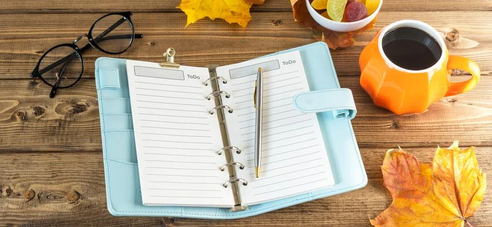 Top view composition with pumpkin styled cup of coffee and autumn themed deco Stock Photos