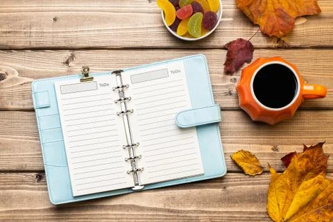 Top view composition with pumpkin styled cup of coffee and autumn themed deco Stock Photos
