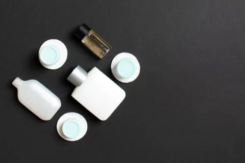 Top view composition of small travelling bottles and jars for cosmetic produc Stock Photos