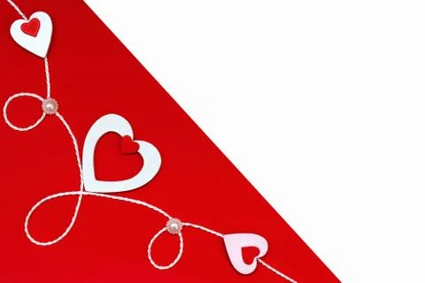 Top view of a composition for Valentine's Day on a red and white background w Stock Photos