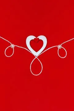 Top view of a composition for Valentine's Day on a red background with white  Stock Photos