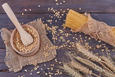 Top view composition of wheat grains on black background. Stock Photos