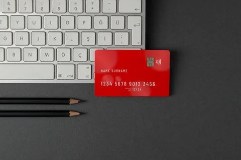 Top view of computer keyboard and credit card on dark gray table Stock Photos