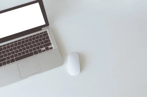 Top view computer laptop mock up and mouse white blank screen on table. Cop.. Stock Photos