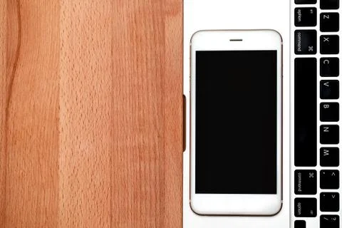Top view computer notebook and smart phone with copy space on wooden Stock Photos