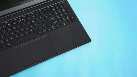 Top view computer notebook laptop on blue background. Stock Photos