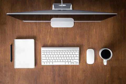 Top view, computer on a wooden table, work desk. Stock Photos