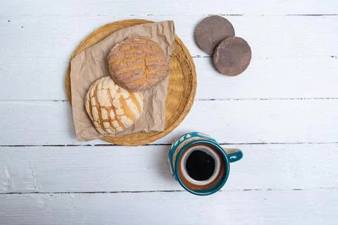 Top view of conchas pan dulce chocolate bars and cup of mexican coffee Photos
