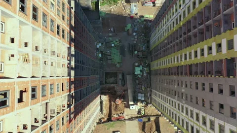 Top view of a construction between two high-rise buildings under construction Stock Footage 143764836