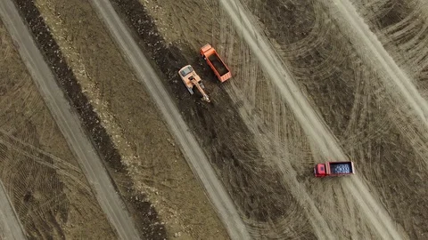 Top view of construction equipment developing a construction site in a field Stock Footage 119836320