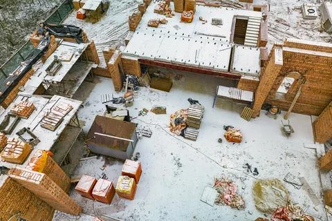 Top view of the construction site. Construction of a red brick house. Buildin Stock Photos
