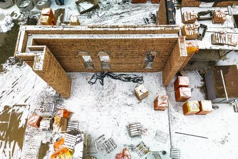 Top view of the construction site. Construction of a red brick house. Buildin 스톡 사진