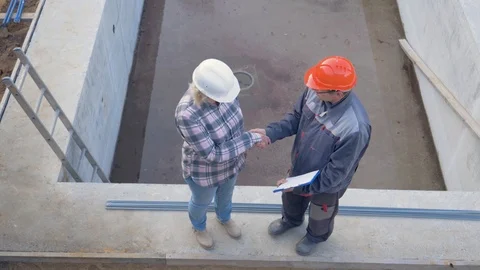 Top View Of The Construction Site Where Customer And Builder To Discuss The Plan Video stock 98863162